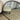 Arched metal wall mirror in a bedroom