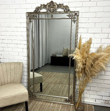Rose Hamptons ornate panelled mirror in champagne against a wall