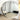 Large round mirror opening up an entryway