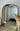 Oakse natural wood arch mirror leaning against a wall
