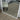 White metal arch mirror in a hallway