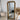 Rounded Louis Philippe mirror in a hallway