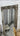 Ornate full length mirror with a carved wooden frame