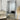 Full length beaded leaning mirror in a living room