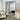 Slim black frame full length mirror leaning in a hallway