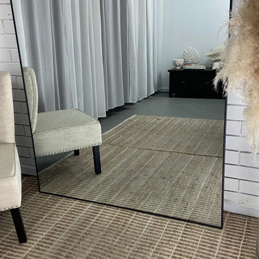 Thin metal frame full length mirror in a contemporary Australian home