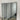 Minimalist thin frame mirror reflecting a styled modern room