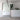 Full length thin frame mirror styled in a living room