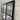 Black industrial grid mirror as a feature wall piece