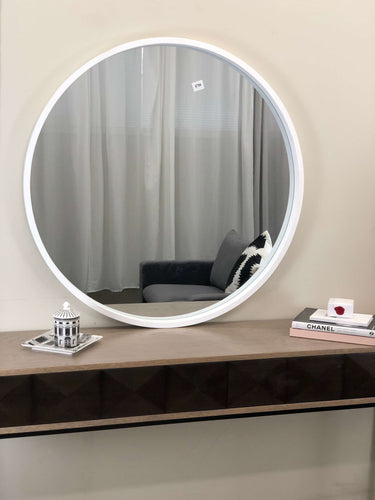 Milano round white wood mirror on a wall