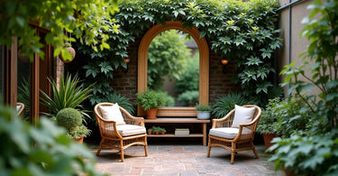 A large arched wooden mirror reflects a green corner with armchairs and plants.