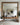 A wood frame mirror hanging on the kitchen wall.