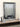 Beaded wall mirror above a mantle