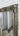 Full length ornate leaning mirror in a bedroom