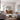 Extra large thin frame arch mirror leaning against a wall