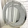 Crystal rounded gem mirror above a console