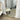 Pill oval mirror hung horizontally on a wall