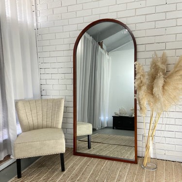 Wooden arch mirror with hand-finished stain