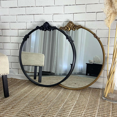Baroque round mirror in a gold finish