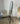 Gold freestanding arch floor mirror in a styled room