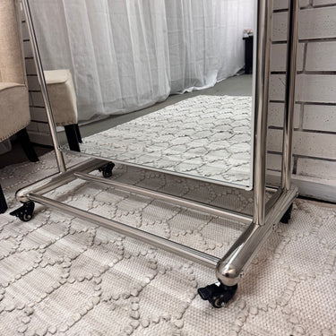 Chrome base and wheels of the Rolling Arch Mirror