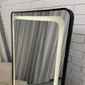Curved LED mirror on its stand