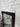 Black carved wooden mirror frame detail