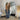 Gold arch floor mirror standing freely in a room
