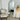 Pill oval full length mirror leaning against a wall