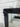French Provincial black mirror above a console table