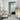 White thin metal frame mirror styled in a contemporary bedroom