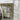 Champagne French Provincial mirror above a mantel