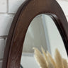 Pebble mirror in a natural wood finish