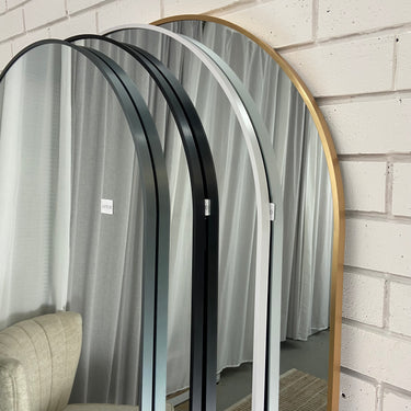 Gold Temple arch mirror in a styled bedroom