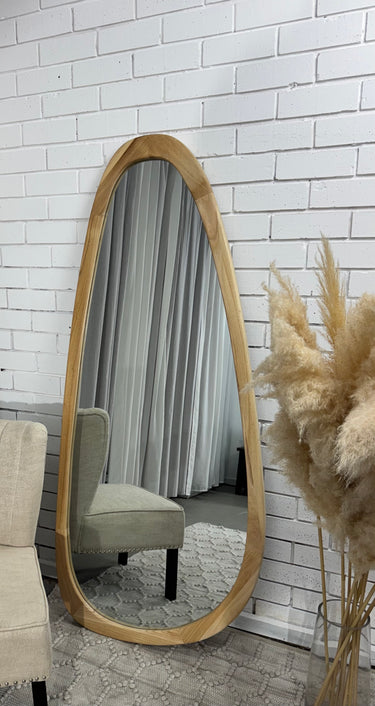 Organic pebble shaped mirror with a wooden frame