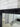 Black French Provincial mirror hung landscape