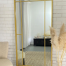 Black metal frame Grid Panel Mirror against a wall