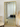 Black metal frame Grid Panel Mirror against a wall