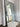 Thin frame full length mirror in a modern living room interior
