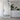 Extra large carved wooden floor mirror against a wall