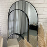 Gold metal arch mirror as a feature piece
