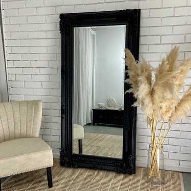 Grand Luxe ornate full length mirror against a wall
