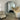 Oversize arch thin mirror in a living room