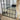 Arch grid window mirror in a hallway