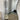 Wavy frameless full length mirror in a room