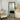 Vienna full length rectangle mirror in champagne leaning against a wall