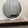 Milano round white wood mirror on a wall