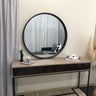 Black round wood mirror in a living room