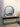 Black round wood mirror in a living room
