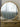 Milano round natural wood mirror on a wall